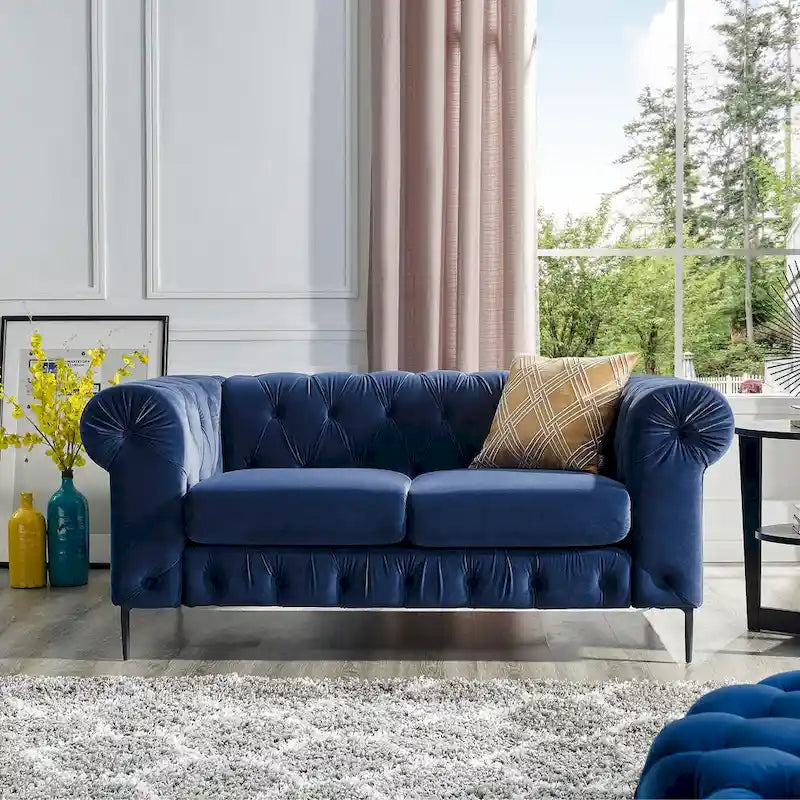 Pikowana dwuosobowa sofa z aksamitu i podłokietnikami w kształcie wałków