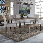 Mesa de comedor rectangular con tablero en patrón de espiga